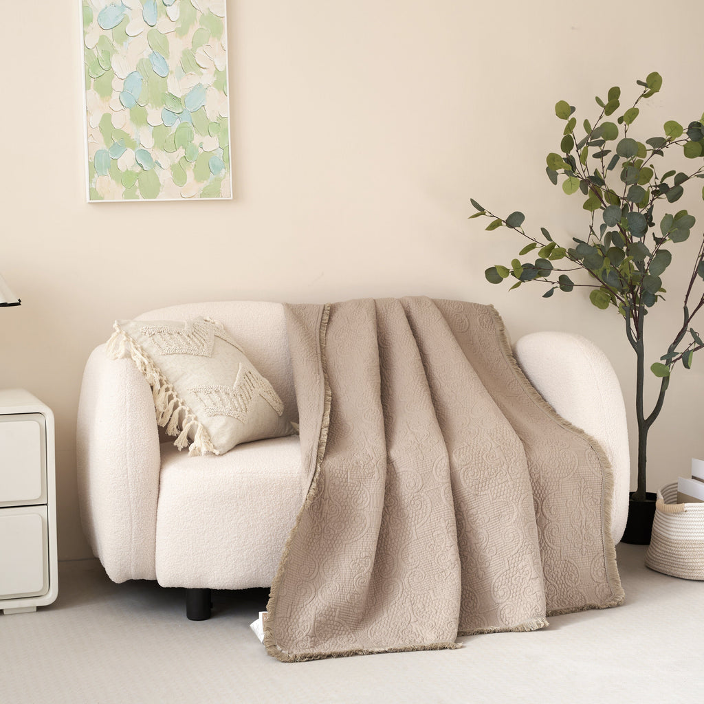 DaDa Bedding Elegant Fringed Cotton Quilted Throw Blanket - Luxurious Solid Soft Paisley Pattern, Cozy Lightweight Lap Throw, Perfect for Couch or Bed, Neutral Sandy Taupe Tan Beige, 50x60 Inches